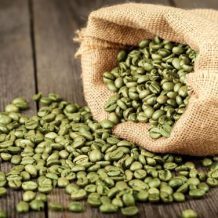 green coffee beans spilling out of bag