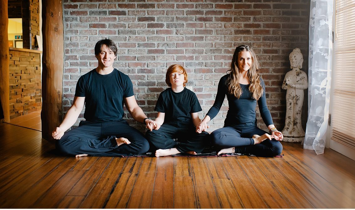 Family sitting and meditating